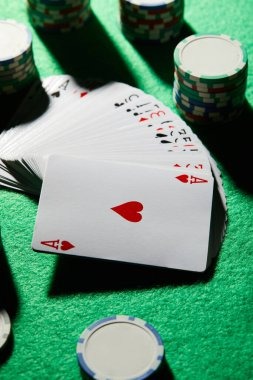 Live dealer at Sic Bo table with three dice visible
